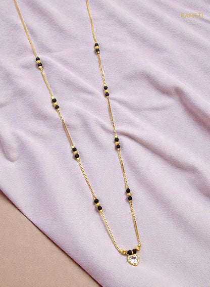 Side profile and craftsmanship of Omka Glistening CZ Studded Party Wear Mangalsutra - Rameti Jewels
